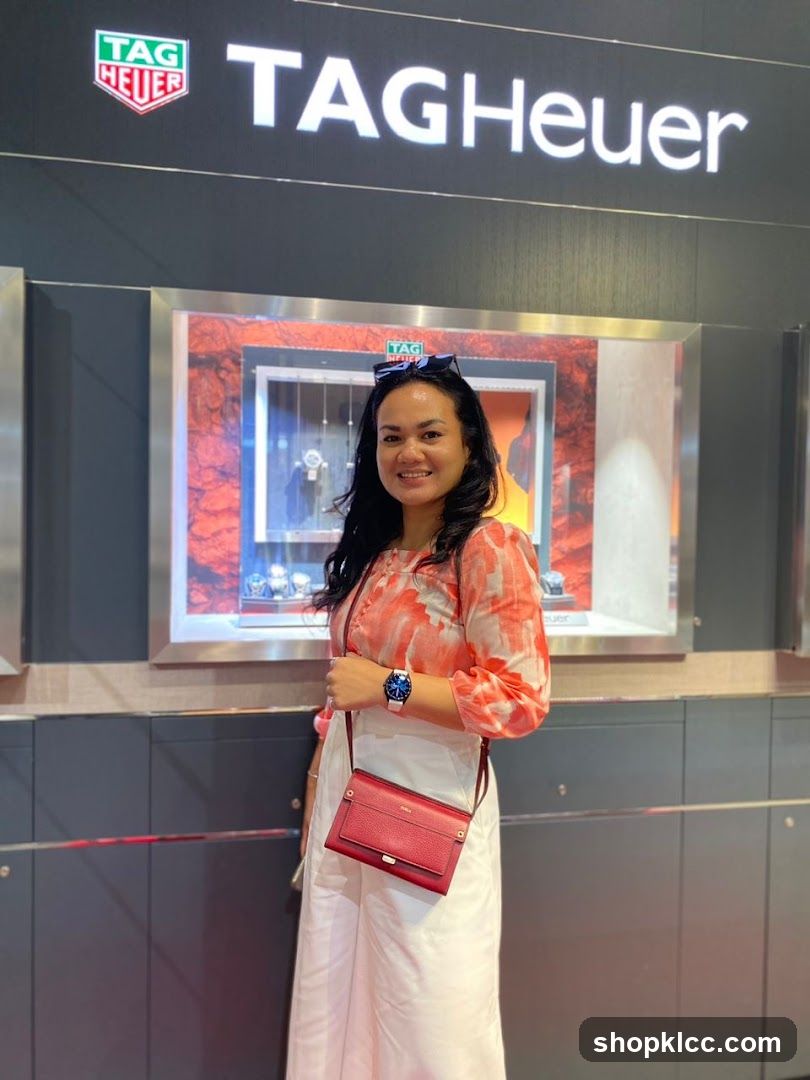 Woman Posing in Front of TAG Heuer Display