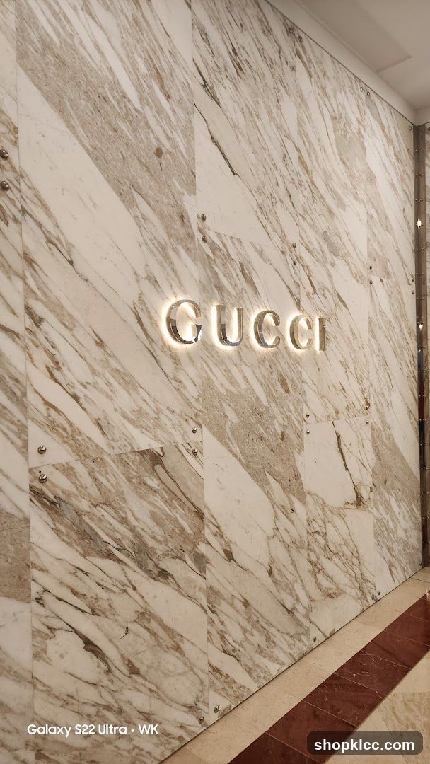 Gucci Logo on Marble Wall