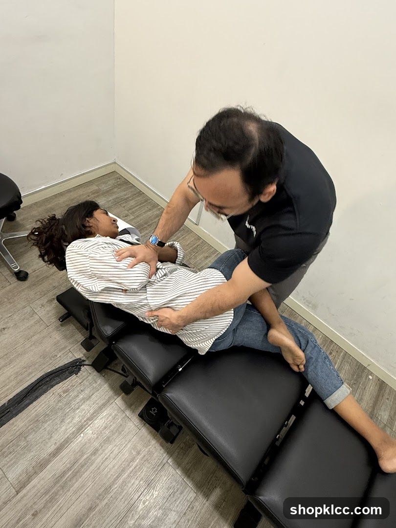Chiropractor adjusting patient