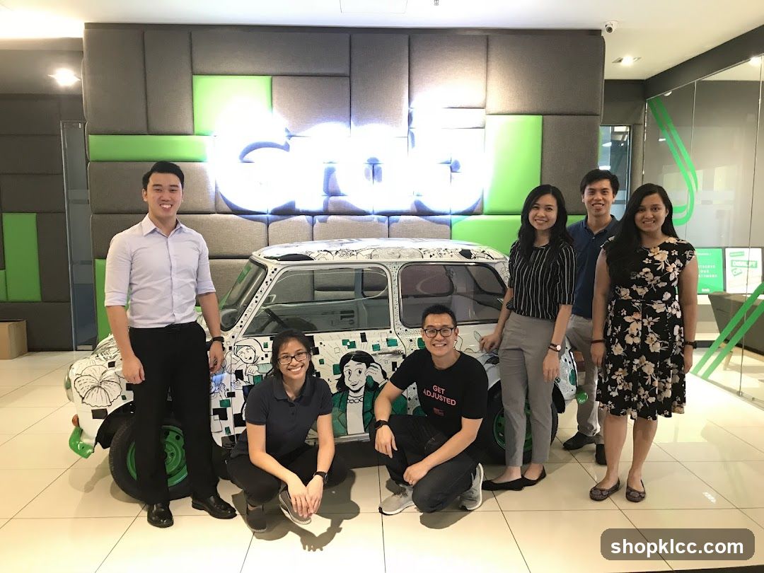 Team Posing with Decorated Car