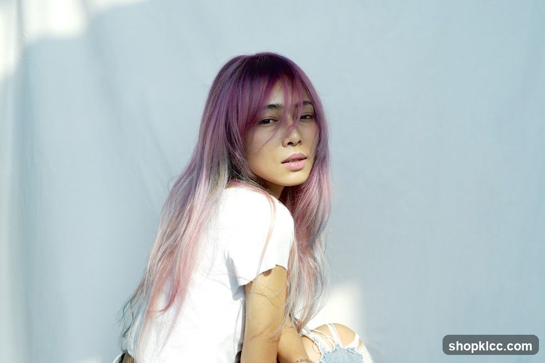 Woman with purple and pink ombre hair