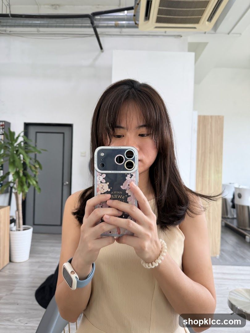 Woman taking a selfie in a salon