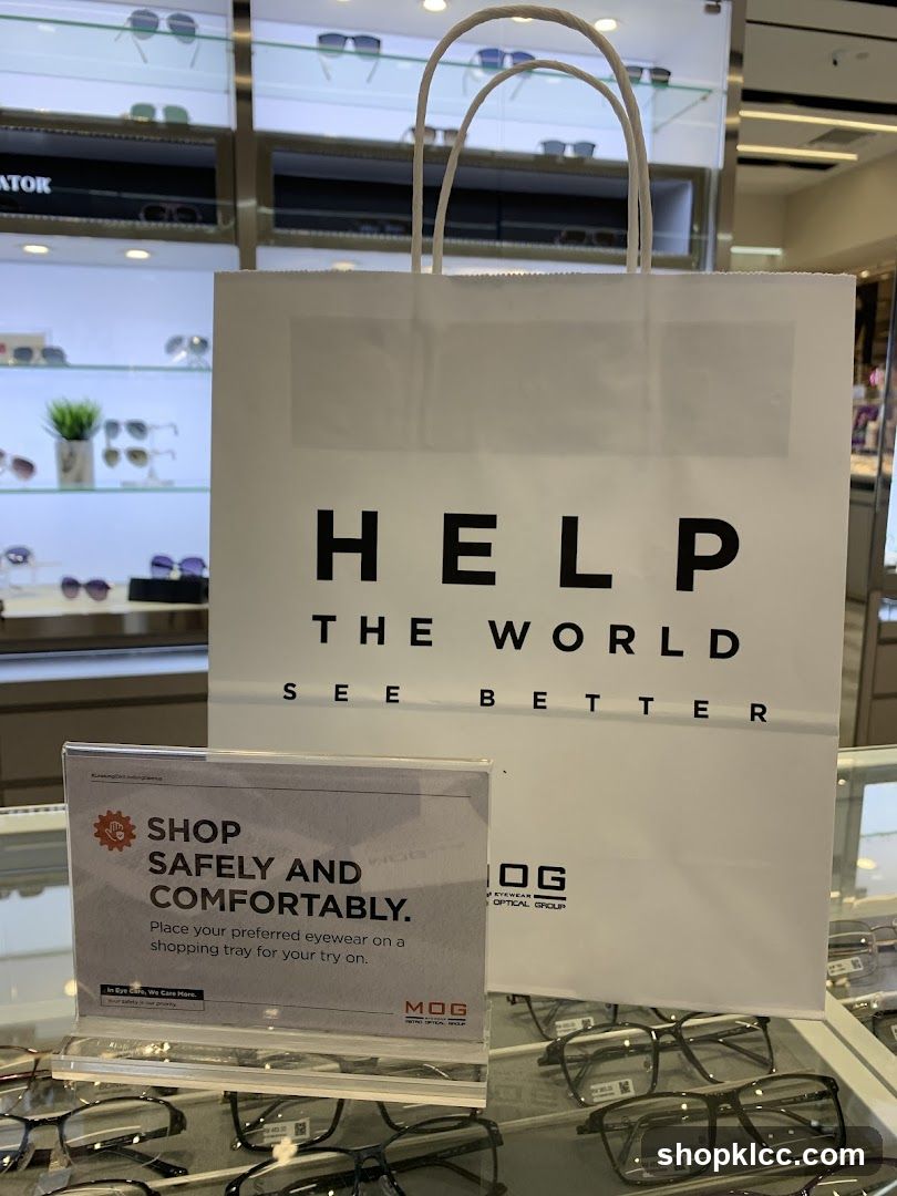 Eyewear store display with shopping bag and safety sign