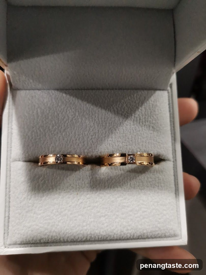 Two gold wedding rings with diamonds in a jewelry box