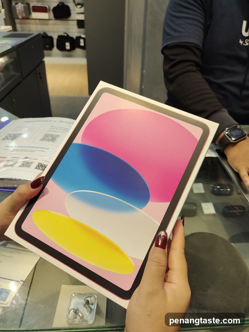 Person holding an iPad box