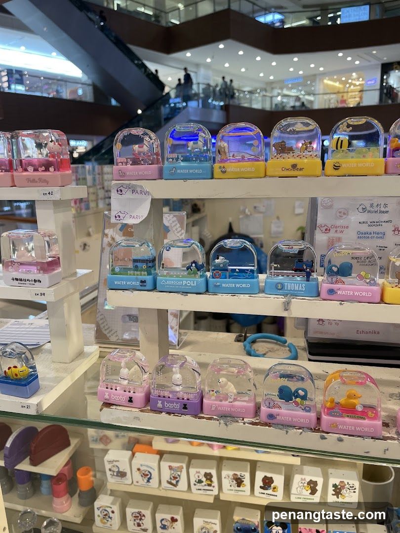 Assortment of Water Snow Globes and Stamps