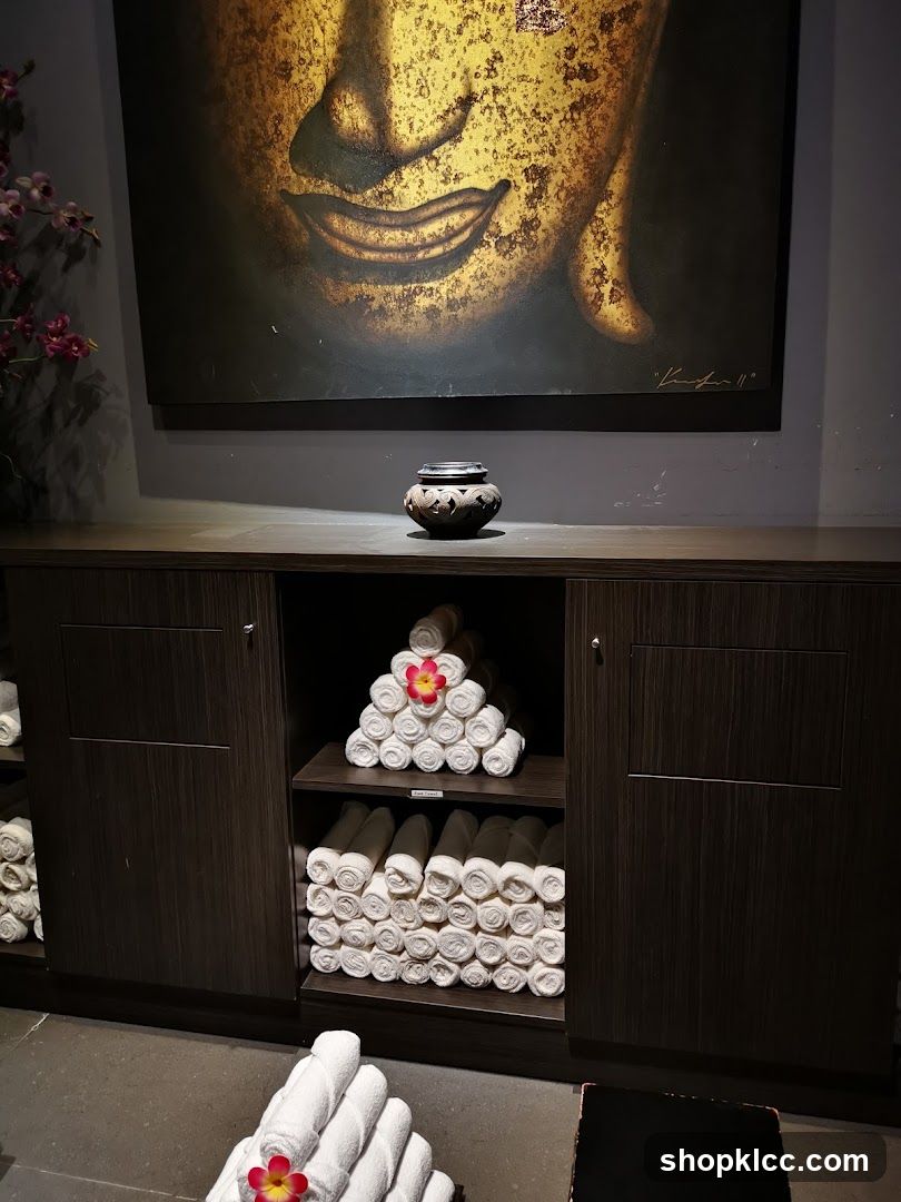 Spa Interior with Buddha Art and Rolled Towels