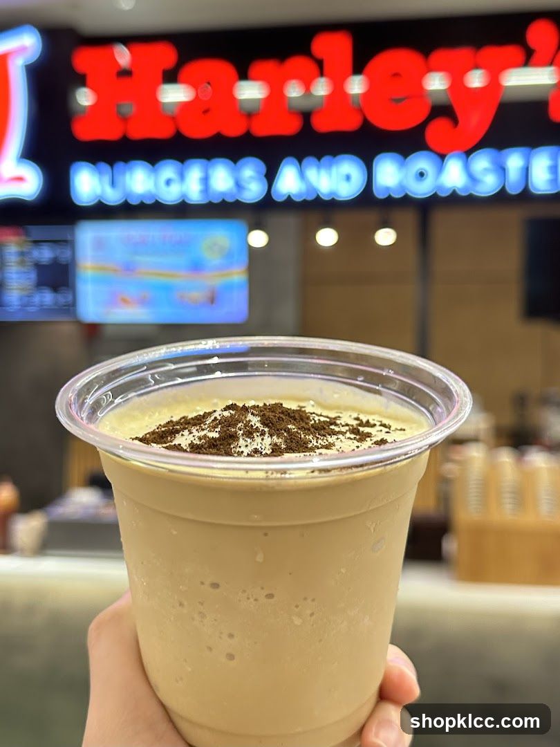 Beverage with Harley's Burgers and Roasted Sign