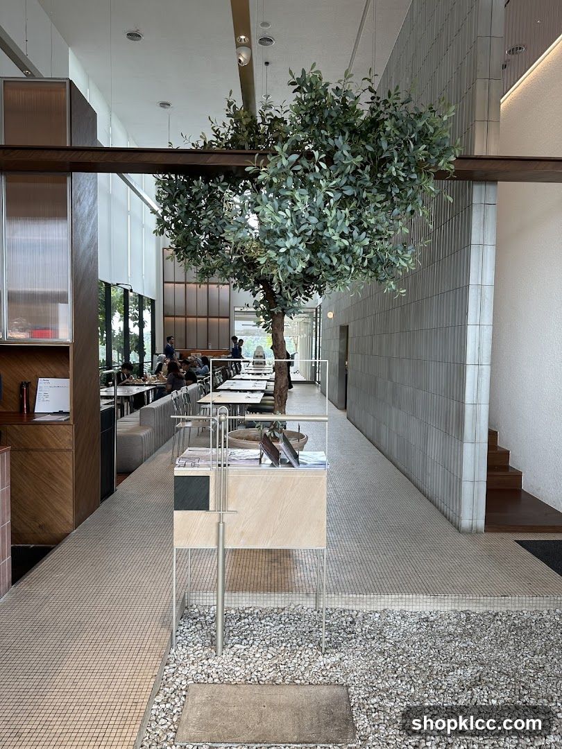 Modern Cafe Interior with Tree Feature