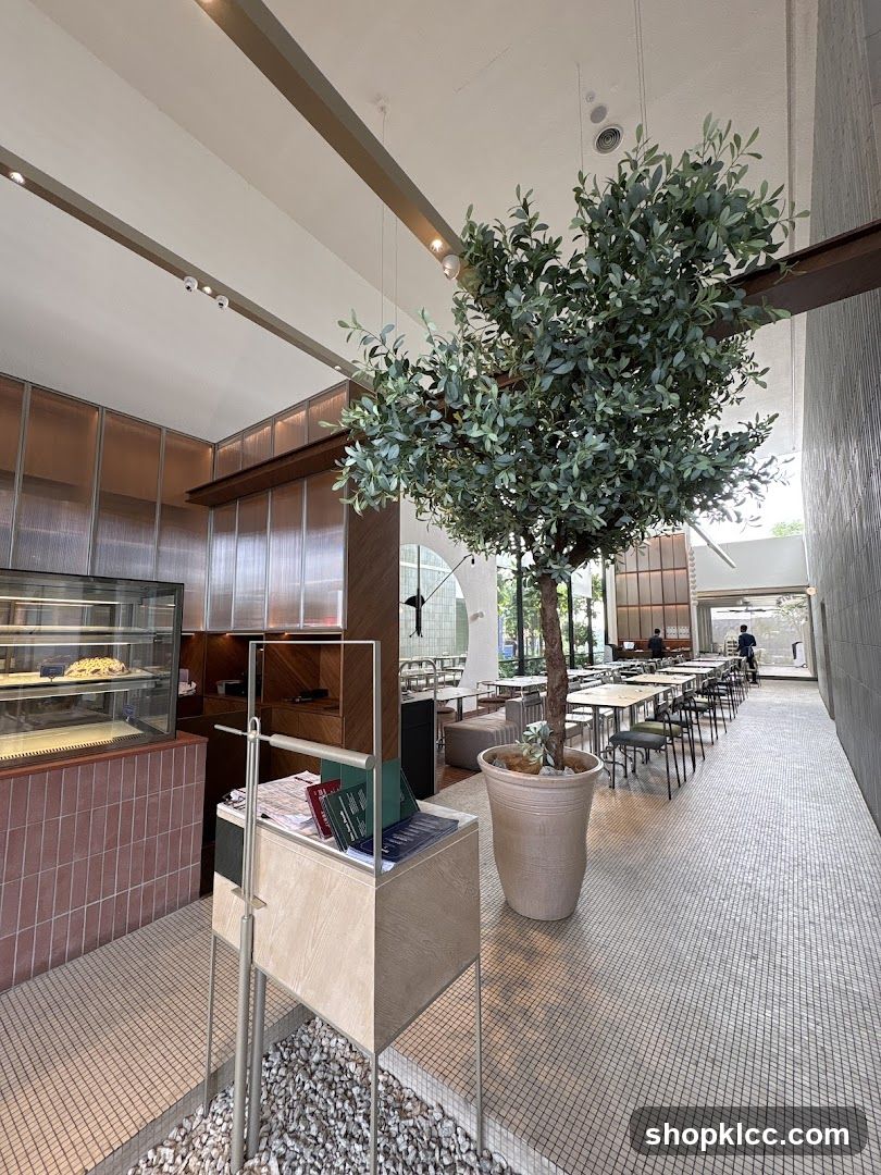 Modern Cafe Interior with Large Tree