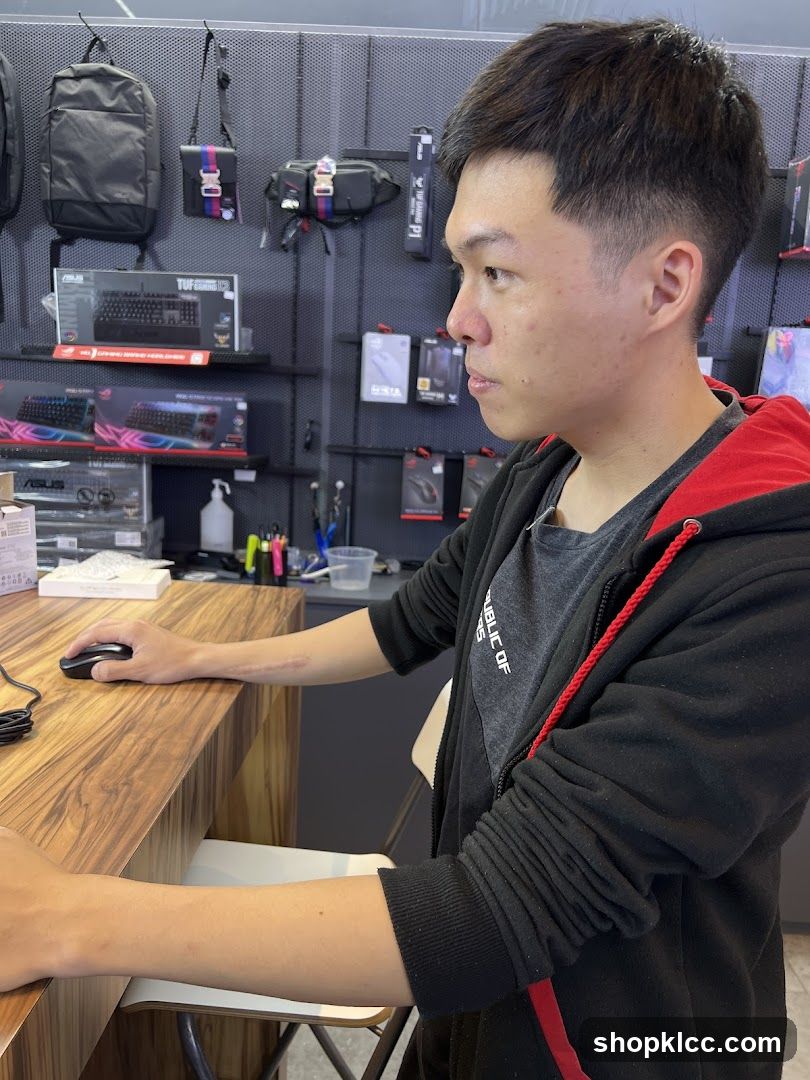 Man using a computer mouse in a store