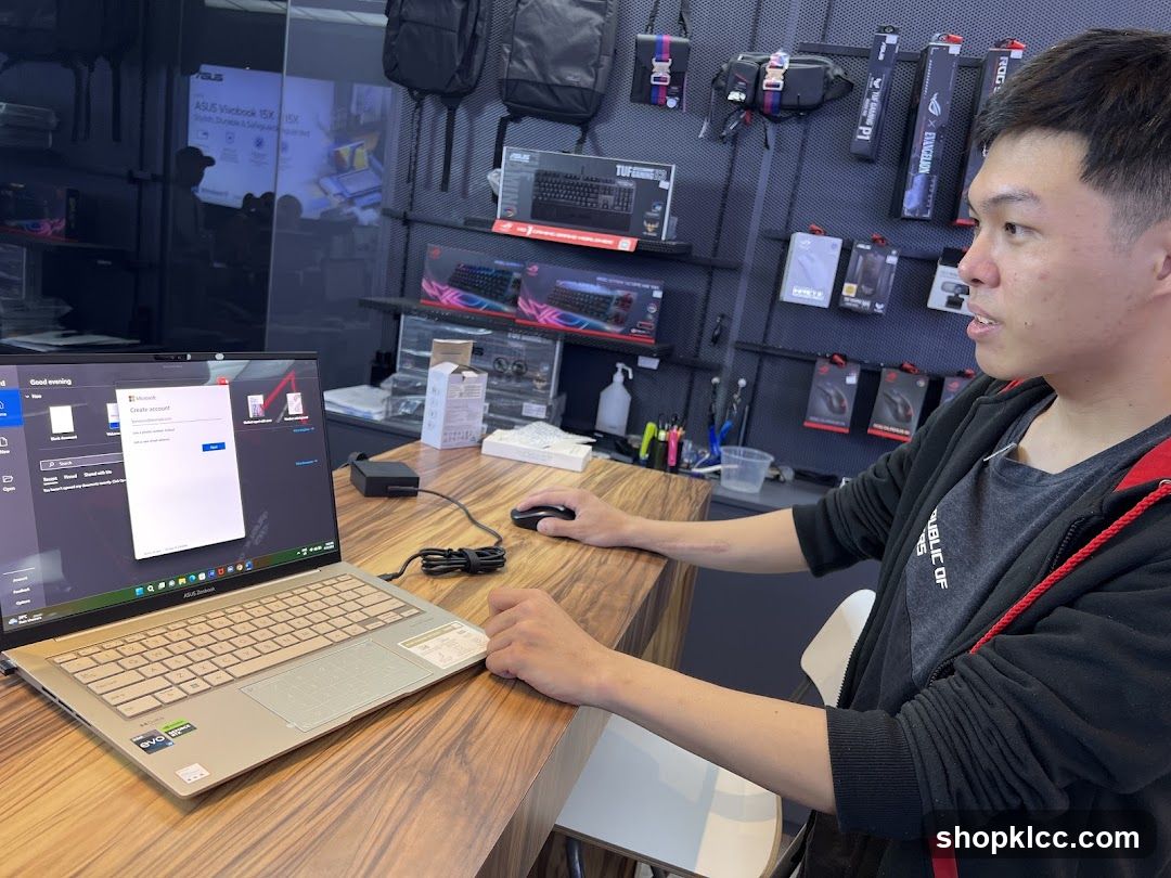 Man using a laptop in a store