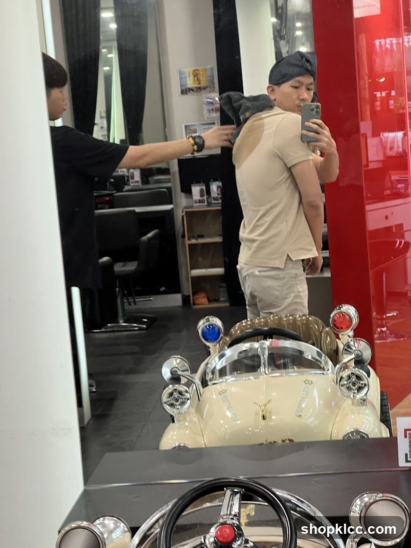Barber drying client's hair