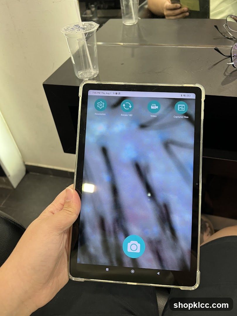 Tablet displaying hair analysis
