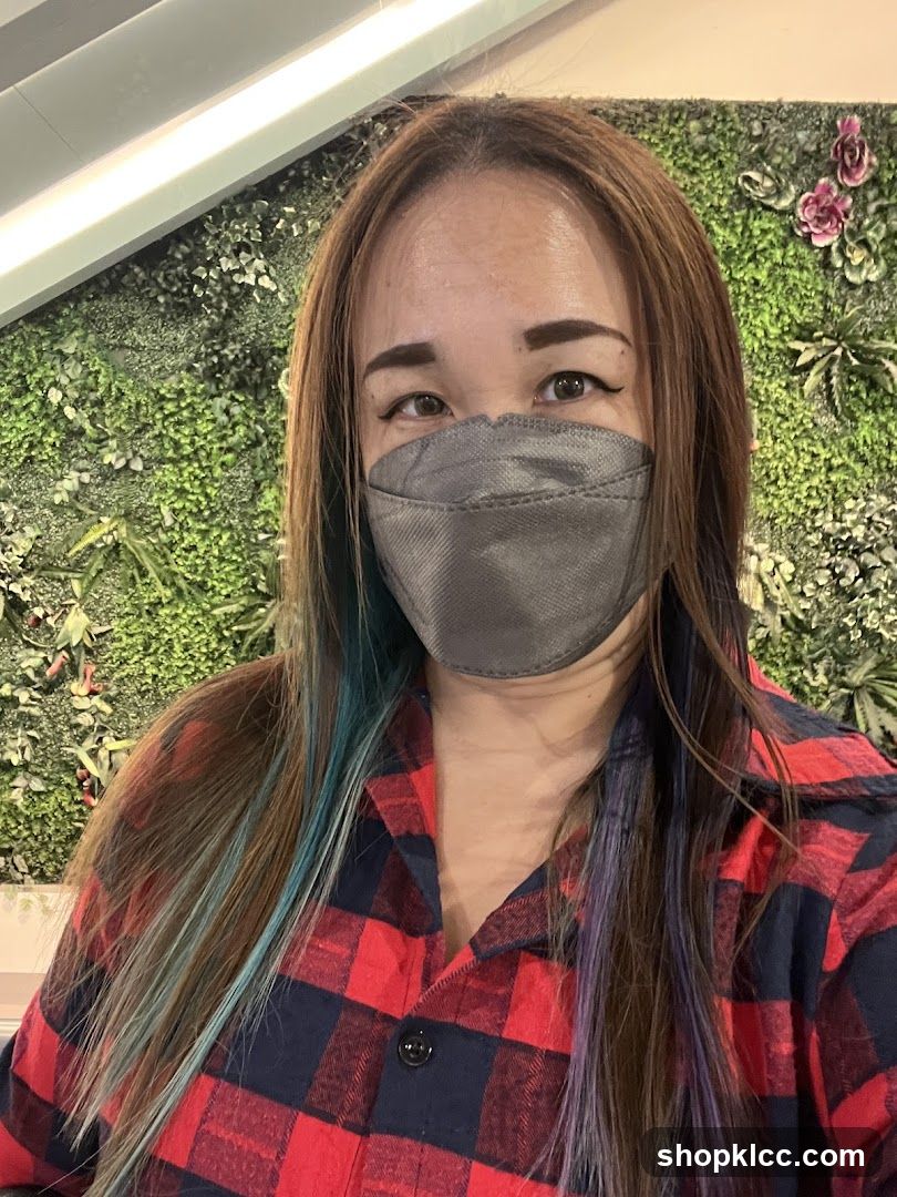 Woman in Plaid Shirt and Mask