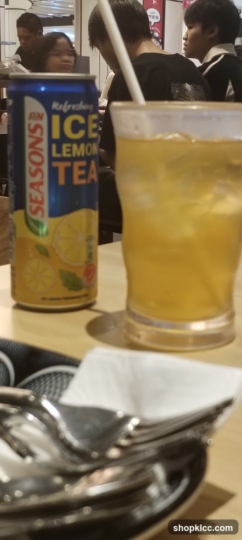 Ice Lemon Tea Can and Drink