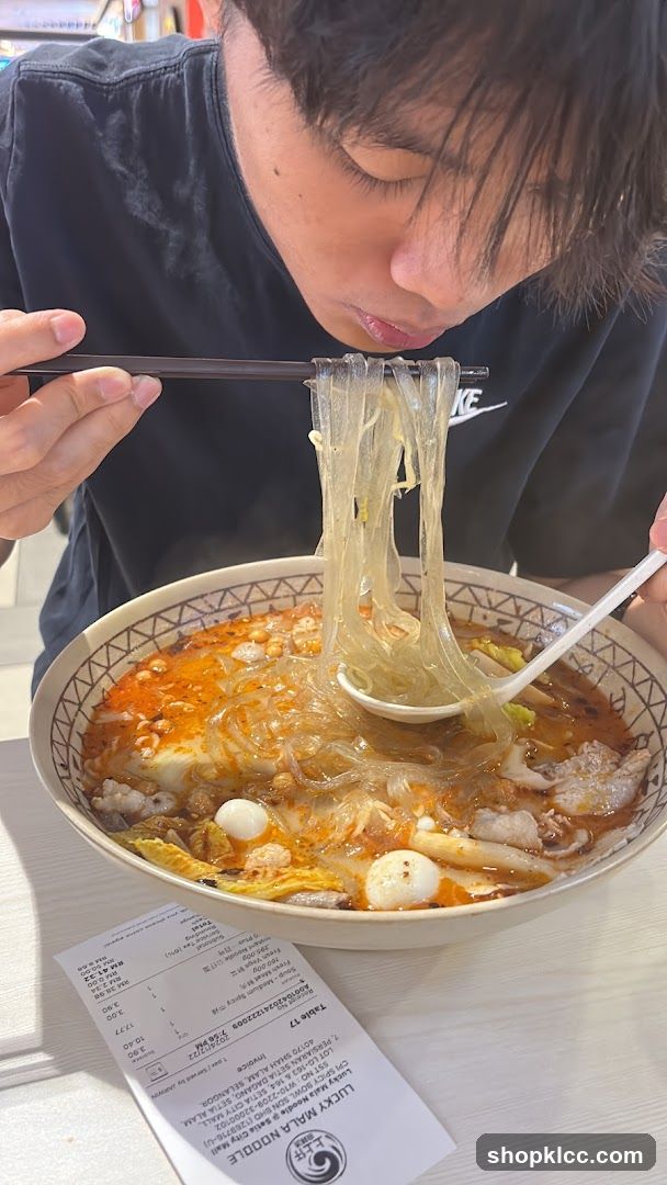 Person eating noodles