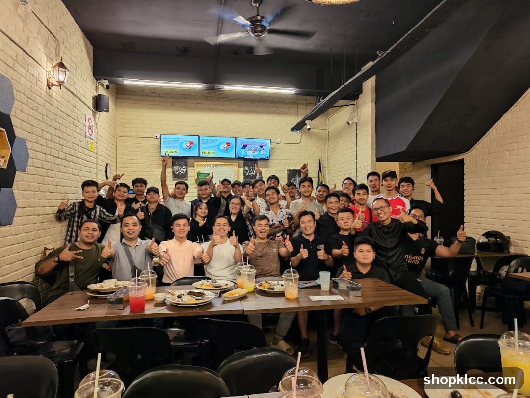 Group of people posing for a photo in a restaurant