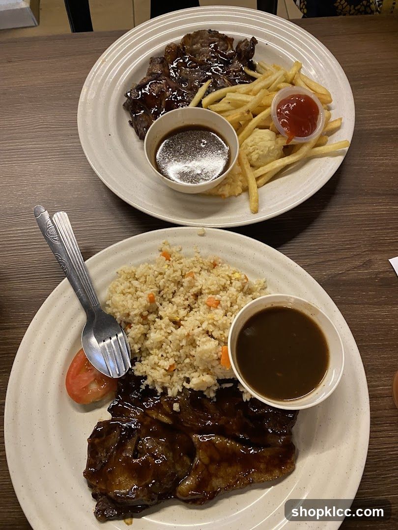 Two plates of steak dinners