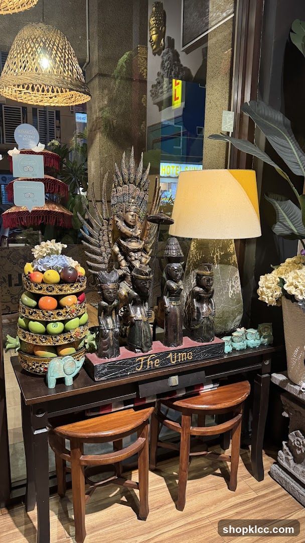 Decorative display with Balinese figurines and fruit stand