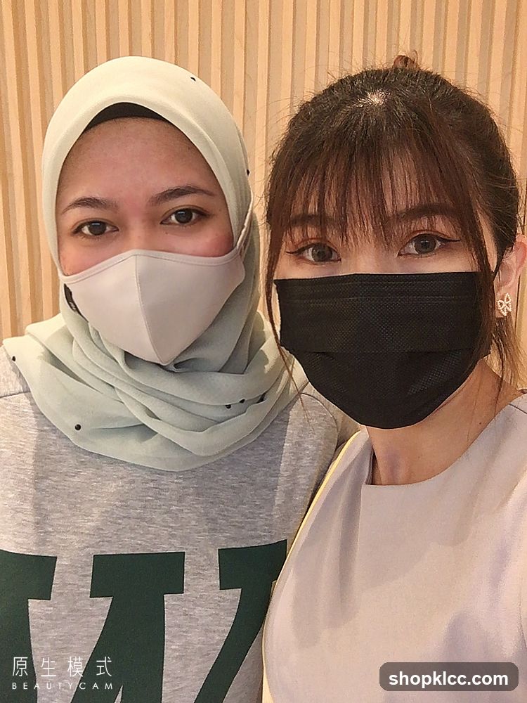 Two women wearing masks