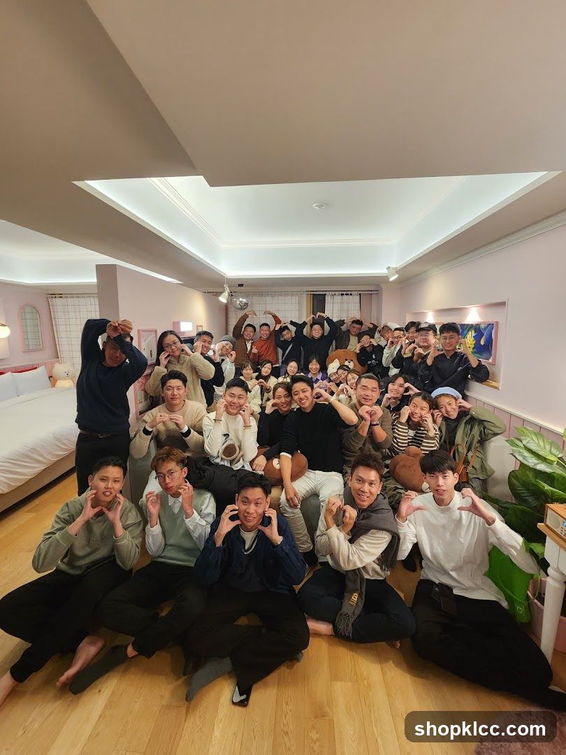 Group of people making heart shapes with their hands