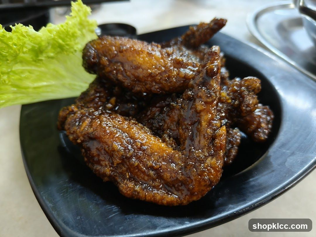 Sauced Chicken Wings with Lettuce Garnish