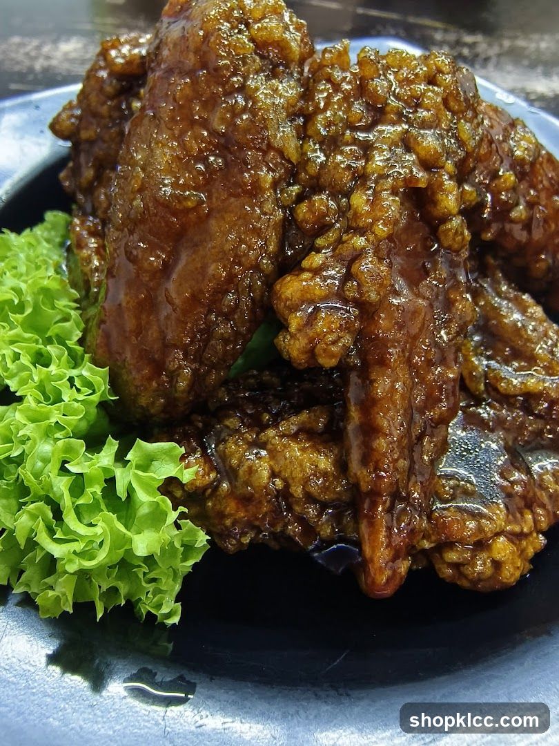 Sauced Fried Chicken with Lettuce Garnish