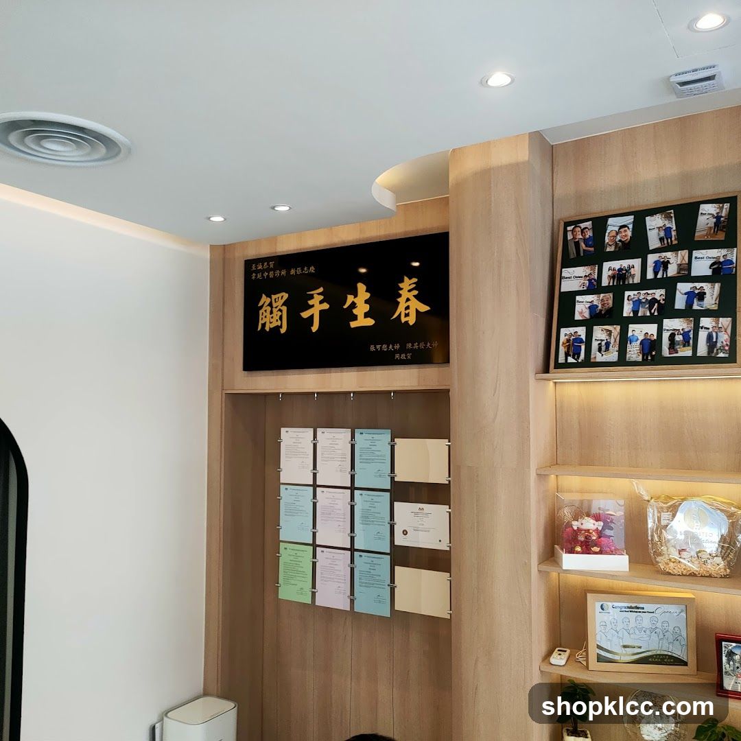 Interior of a business space with display wall and framed photos