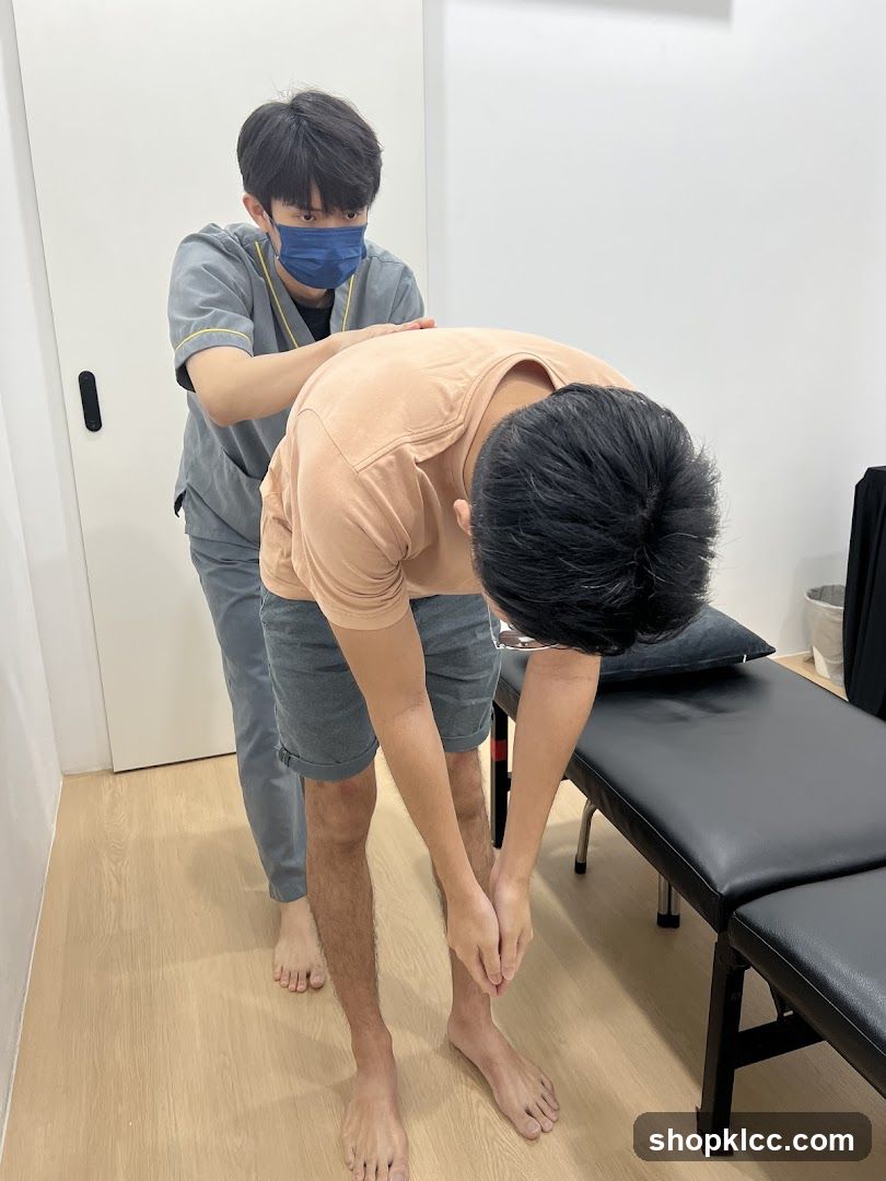 Therapist Assisting Patient with Stretching Exercise