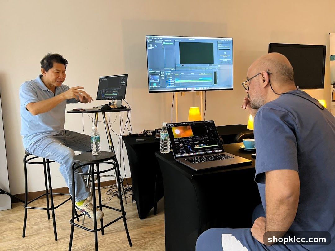 Two men working on video editing software