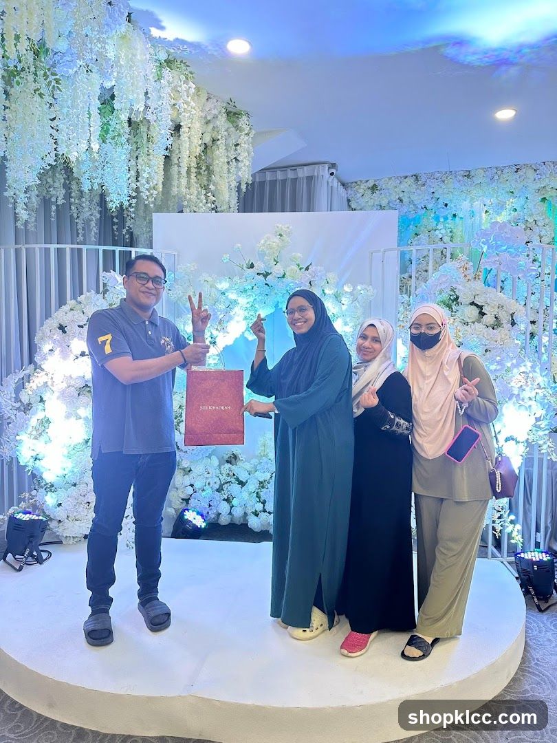 People Posing with a Gift Bag