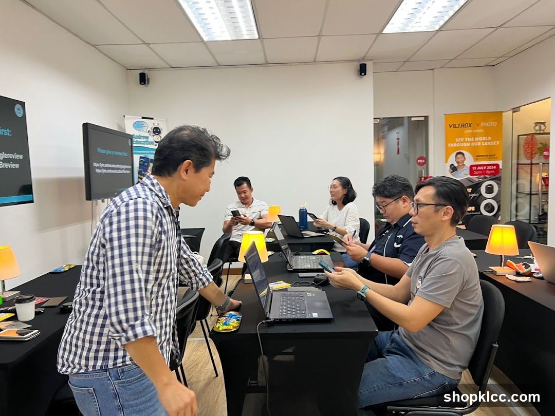 Workshop attendees using laptops and phones