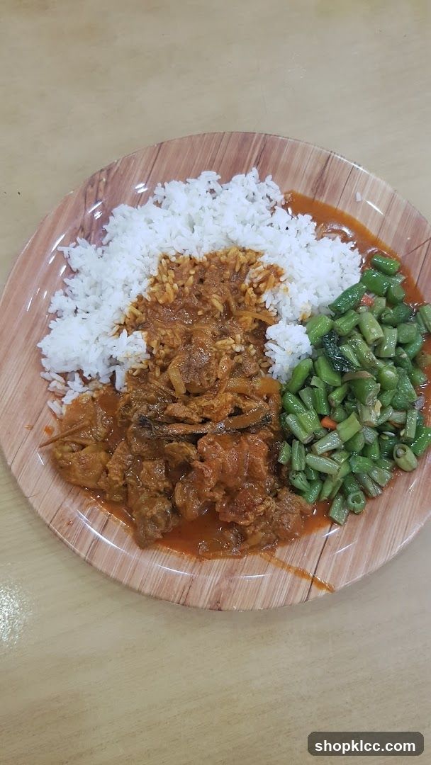 Plate of Rice with Curry and Vegetables