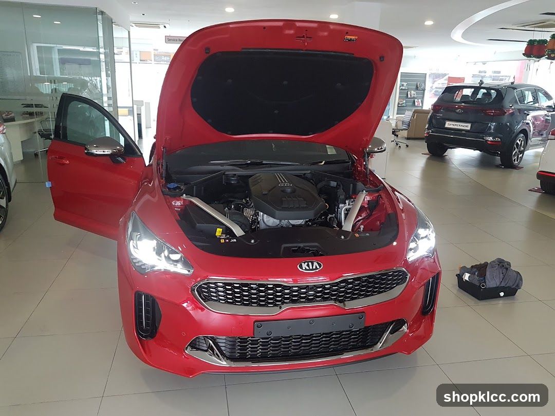 Red Kia Car in Showroom