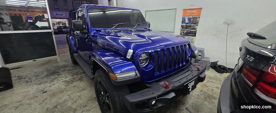 Blue Jeep Wrangler in Workshop