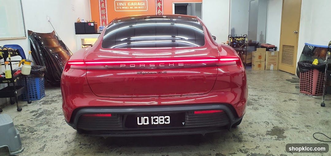 Red Porsche Taycan in Workshop
