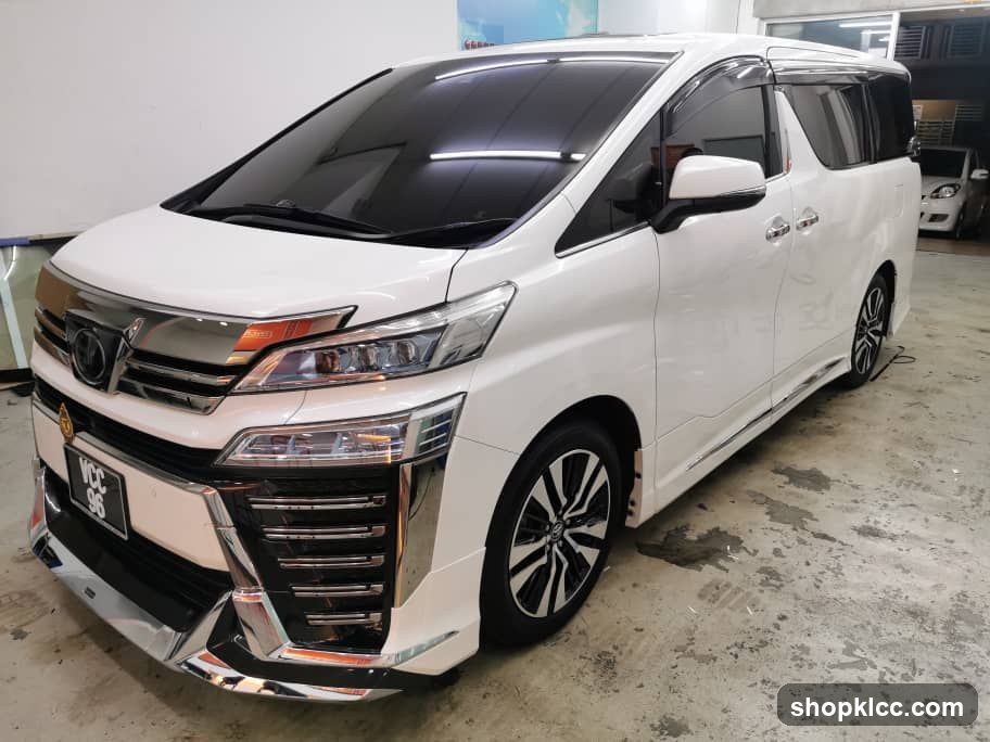 White Toyota Alphard in a garage