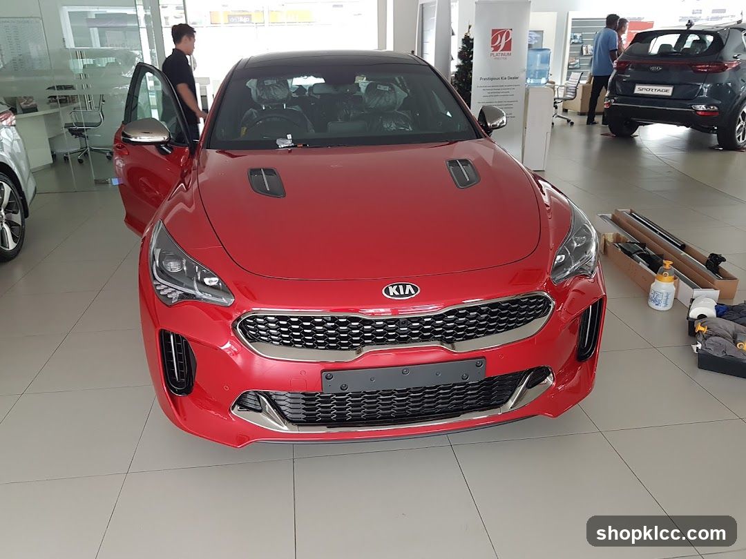 Red Kia Car in Showroom