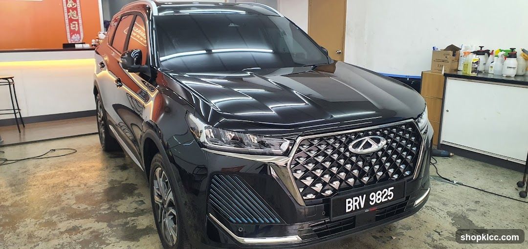 Black Infiniti QX60 in a workshop or garage setting