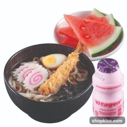 Udon noodles with tempura shrimp, egg, fish cake, seaweed, watermelon, and a bottle of Vitagen yogurt drink.