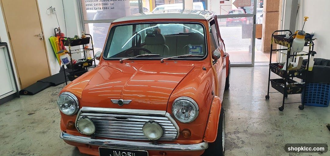 Orange Mini Cooper in Garage