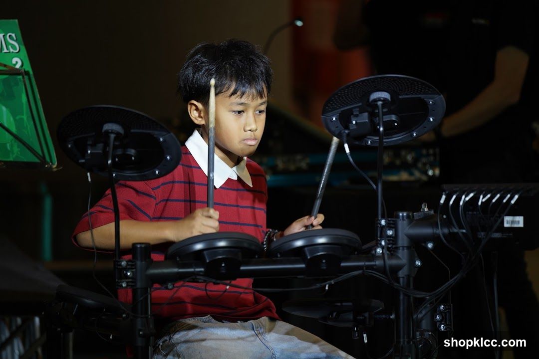 Boy Playing Electronic Drum Kit