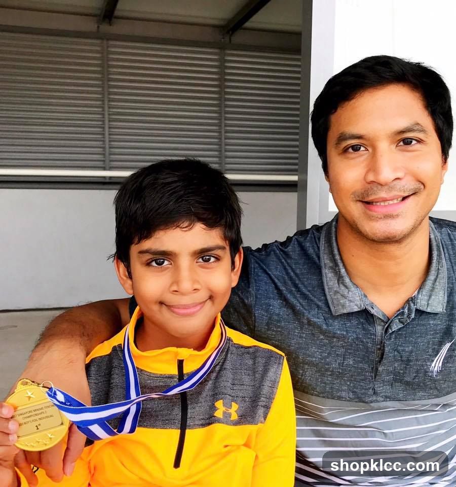 Boy with Gold Medal and Father