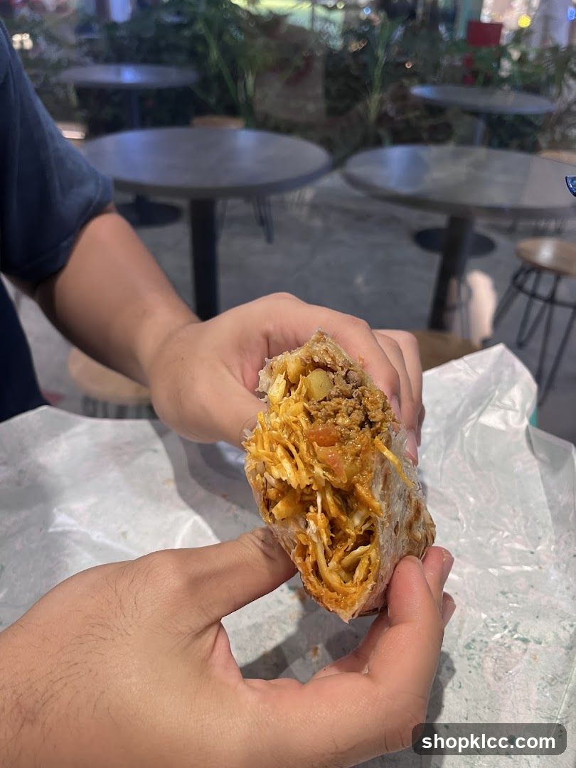 Person holding a burrito