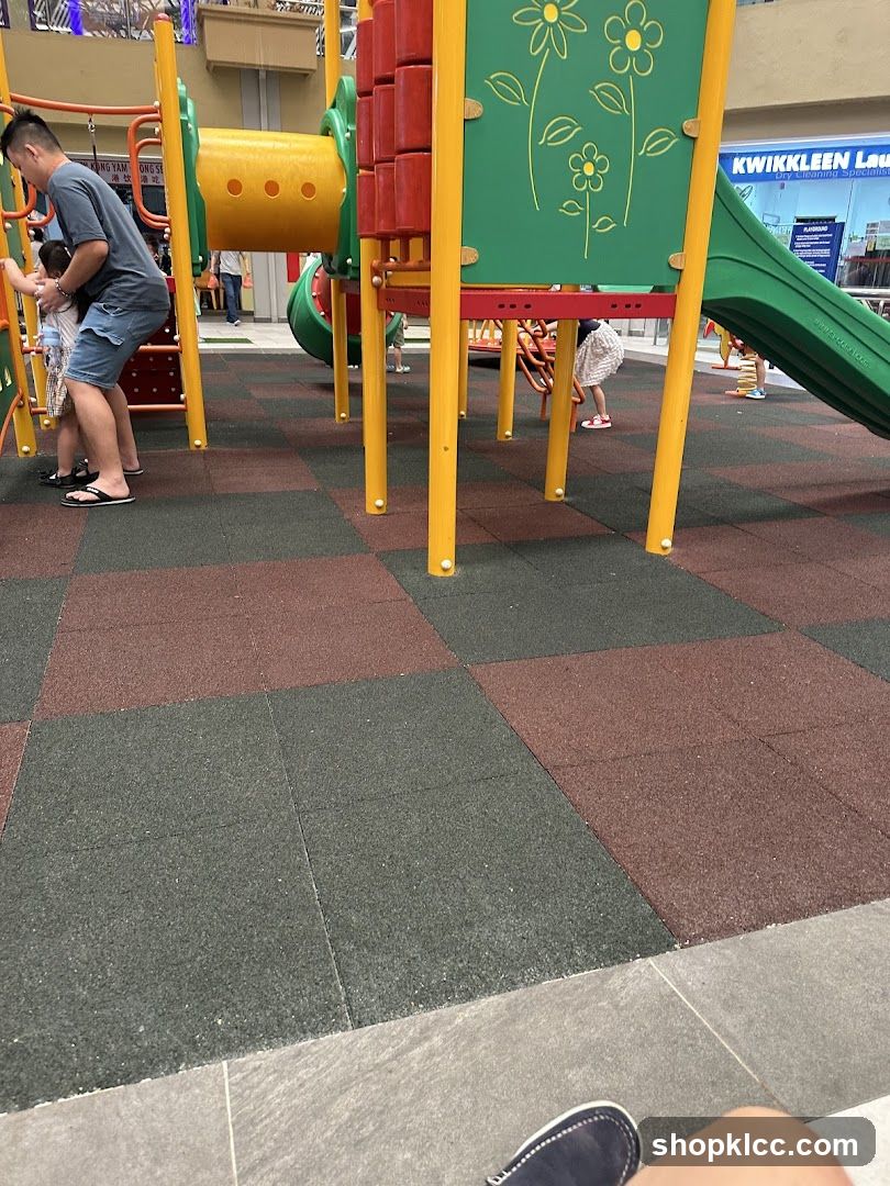 Playground Area with Storefront in Background