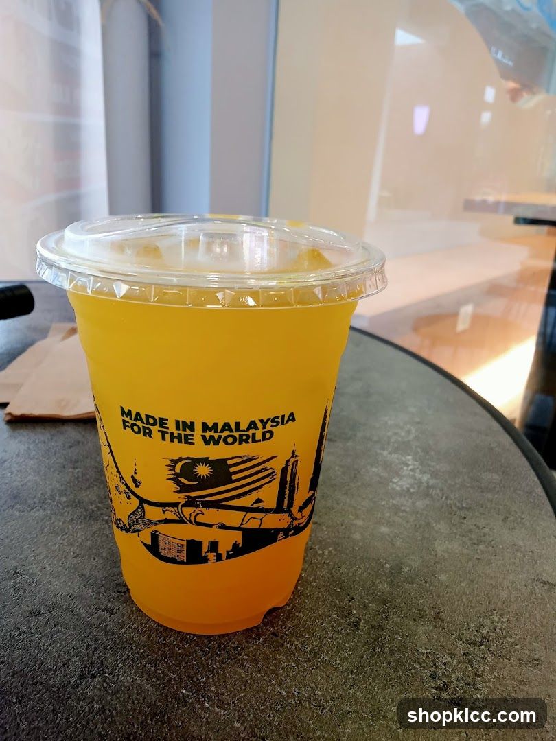 Orange Drink in a Branded Cup