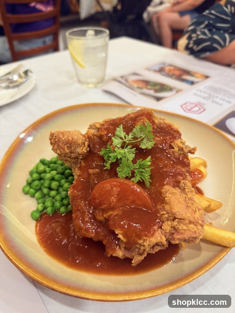 Fried Chicken Dish with Peas and Fries