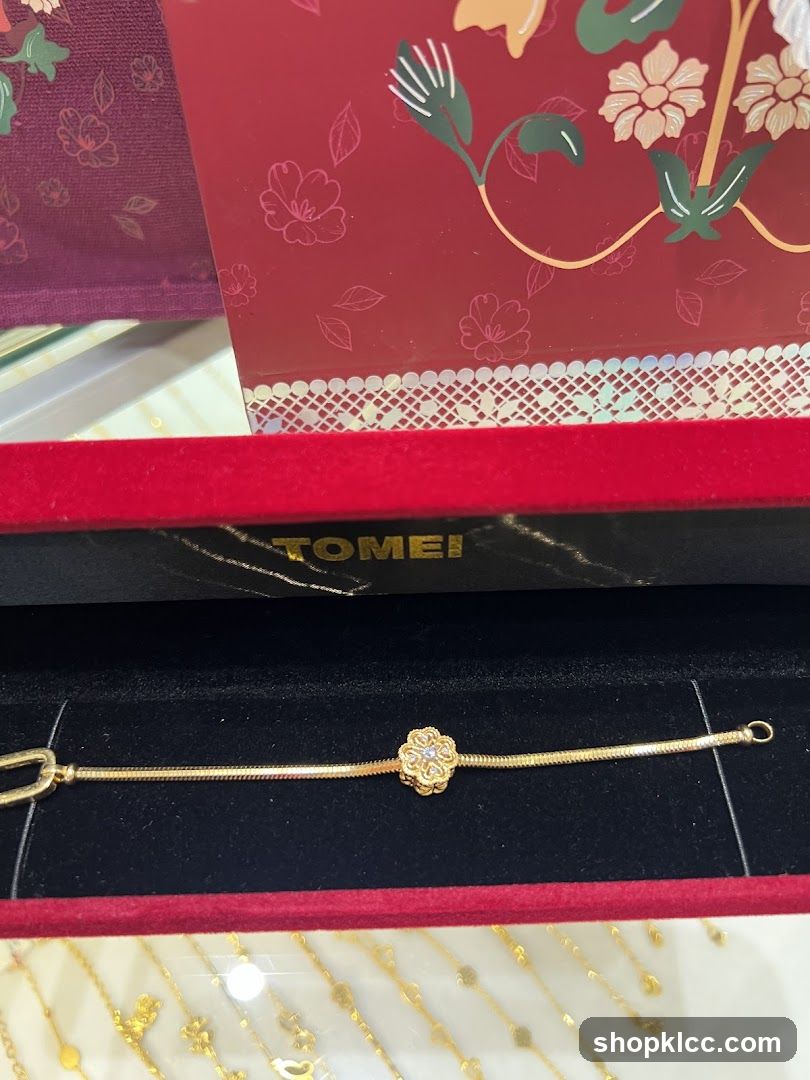 Gold Bracelet with Flower Charm