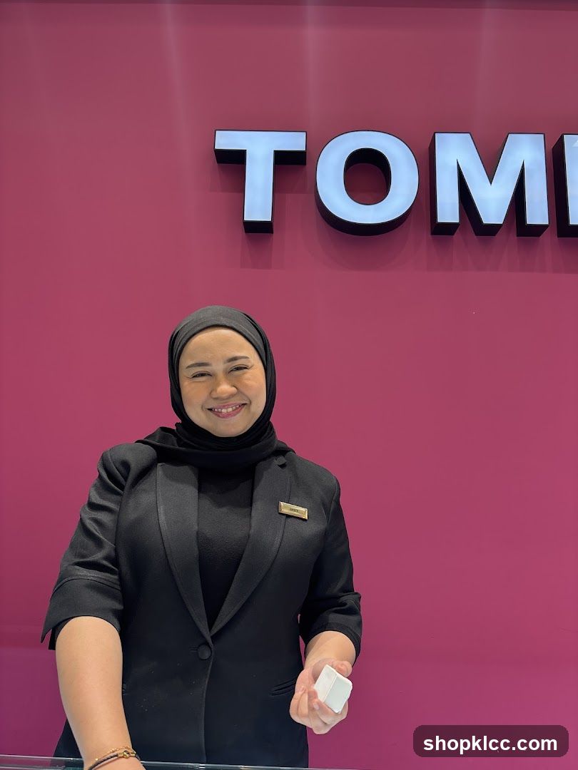 Employee in front of store sign